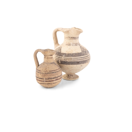 685 - TWO ANCIENT CYPRIOT BIOCHROME POTTERY JUGS, Iron Age, c. 1,000 - 500 BC, each of similar shape, with... 