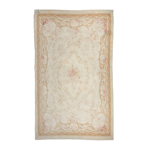 689 - A LARGE AUBUSSON TAPESTRY CARPET. 374 x 242CM  the cream ground field woven with central floral meda... 