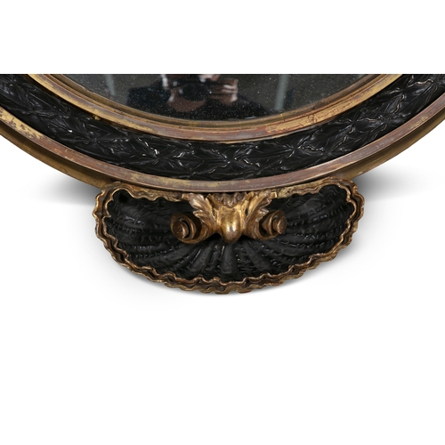 706 - A GILTWOOD AND EBONISED CIRCULAR CONVEX MIRROR, EARLY 19TH CENTURY,   the glass plate surrounded by ... 