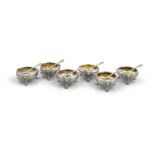 715 - A SUITE OF SIX VICTORIAN SILVER CIRCULAR TABLE SALTS, IN THE GEORGIAN STYLE    London c.1863 mark of... 