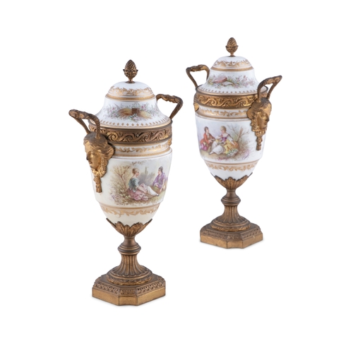 719 - A PAIR OF SEVRES STYLE PORCELAIN AND ORMOLU MOUNTED URNS, Signed A. Daret, 33cm(h)