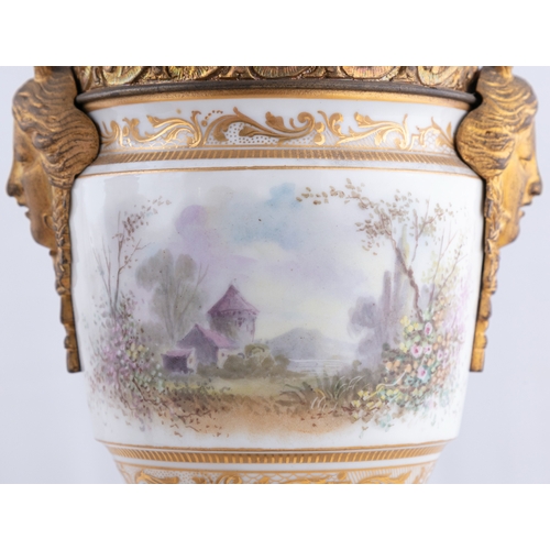 719 - A PAIR OF SEVRES STYLE PORCELAIN AND ORMOLU MOUNTED URNS, Signed A. Daret, 33cm(h)