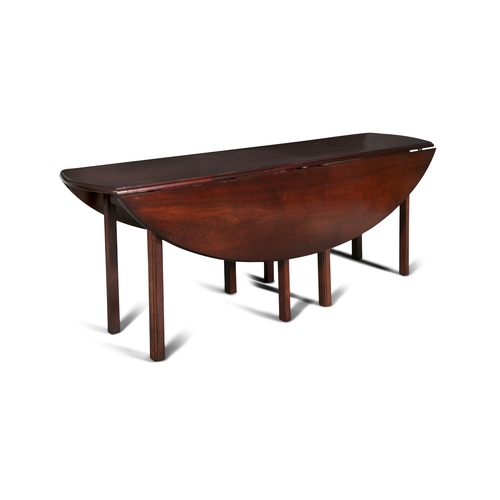 745 - A MAHOGANY LARGE OVAL HUNT TABLE 20TH CENTURY,   having twin drop-leaf sides, moulded and rounded ed... 