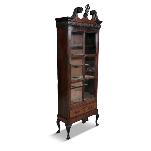 752 - AN IRISH GEORGE II BOOKCASE ON STAND,   of upright rectangular form, surmounted with swan neck pedim... 