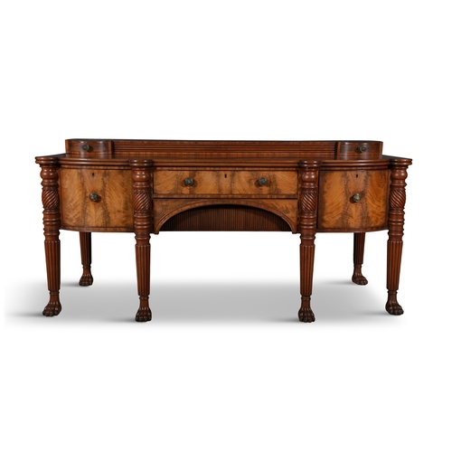 104A - AN IRISH GEORGE IV MAHOGANY SIDEBOARD CIRCA 1825,  shaped moulded top, the reeded superstructure wit... 