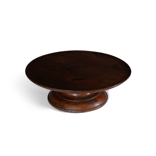 107 - AN EARLY VICTORIAN MAHOGANY LAZY SUSAN   the revolving dished top on waisted central column and moul... 