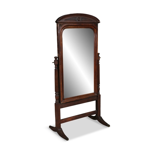 109 - A VICTORIAN MAHOGANY FRAME CHEVAL MIRROR  arched top above plain adjustable plate supported on flute... 