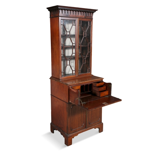 117 - A GEORGE III MAHOGANY COMPACT SECRETAIRE BOOKCASE,  early 19th century, the moulded Greek key cornic... 