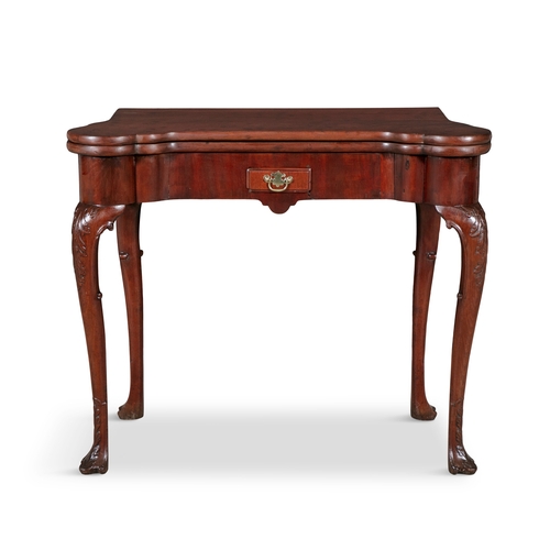 120 - AN IRISH GEORGE II MAHOGANY FOLD TOP TEA TABLE,  the shaped rectangular folding top opening to a pla... 