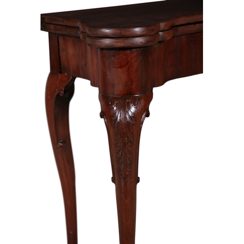 120 - AN IRISH GEORGE II MAHOGANY FOLD TOP TEA TABLE,  the shaped rectangular folding top opening to a pla... 