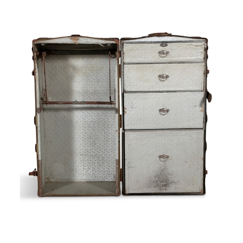 129 - AN EDWARDIAN STRAPWORK BOUND WARDROBE TRAVELLING TRUNK,  opening to two sections, one for hanging, t... 