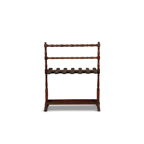 130 - A MAHOGANY BOOT / TACK STAND 19TH CENTURY,   with hanging rail and double sided six-notch rack. 97cm... 