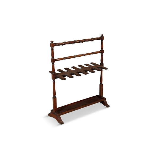 130 - A MAHOGANY BOOT / TACK STAND 19TH CENTURY,   with hanging rail and double sided six-notch rack. 97cm... 