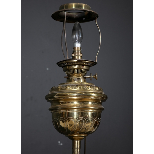 134 - A CONTINENTAL BRASS STANDARD LAMP,   the fluted column centred with a circular rouge marble platform... 