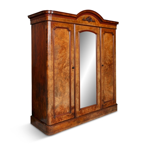 135 - A VICTORIAN WALNUT WARDROBE,  the domed top with moulded cornice, above central mirrors section, fla... 