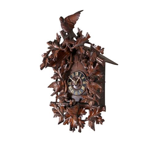 147 - A CARVED 'BLACK FOREST' LINDEN WOOD CUCKOO CLOCK, EARLY 20TH CENTURY   in the form of a bird house c... 