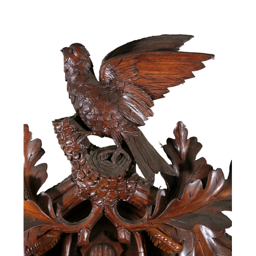 147 - A CARVED 'BLACK FOREST' LINDEN WOOD CUCKOO CLOCK, EARLY 20TH CENTURY   in the form of a bird house c... 