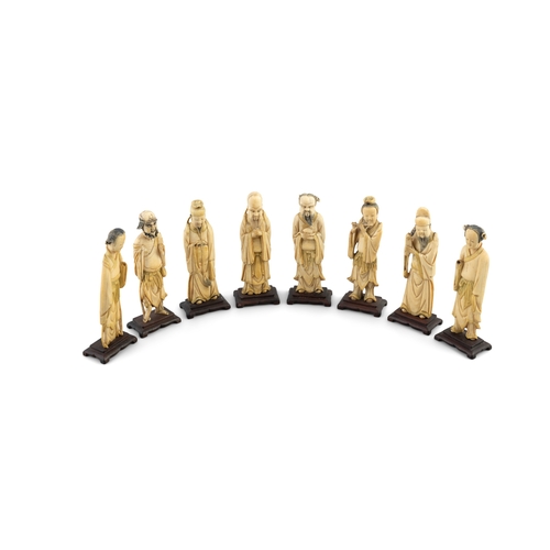 154 - A GROUP OF EIGHT CARVED BONE STANDING FIGURES 20TH CENTURY,  modelled as the eight Chinese immortals... 