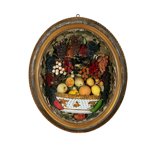 16 - AN AMERICAN WAX FRUIT STILL LIFE DIORAMA 19TH CENTURY,  contained within an oval giltwood frame. 70c... 