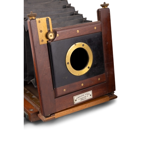 172 - A TIMBER AND BRASS FOLDING PLATE CAMERA EARLY 20TH CENTURY,  retailed by J Robinson & Son's 66 Graft... 