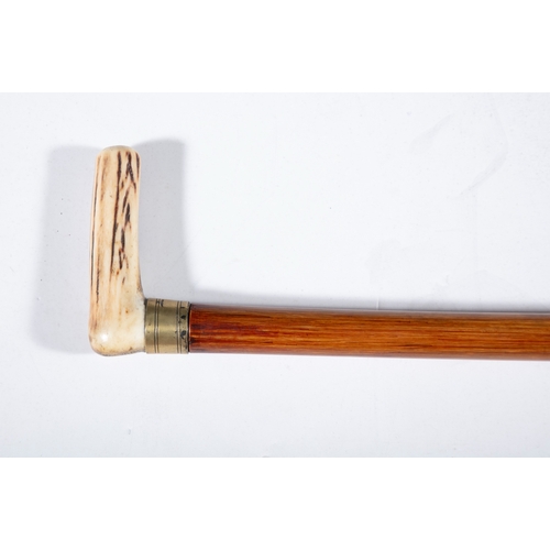 183 - A 'HANDS MEASURE' WALKING STICK,  the angled handle twisting off to reveal internal measuring rod wi... 