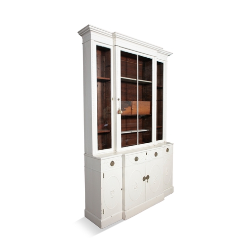 189 - A WHITE-PAINTED BREAKFRONT SECRETAIRE BOOKCASE EARLY 19TH CENTURY,   the moulded cornice above plain... 