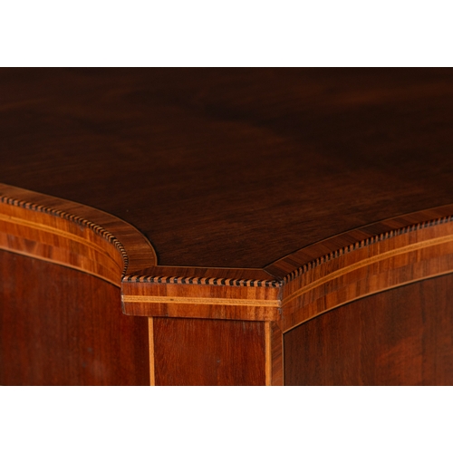 199 - AN IRISH SATINWOOD AND INLAID TABLE BY JAMES HICKS  the serpentine top above a frieze with crossband... 