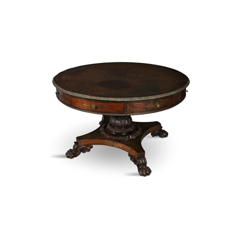 204 - A REGENCY ROSEWOOD AND BRASS INLAID DRUM TABLE,   the circular top with tooled brown leather inset a... 