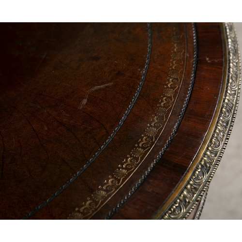 204 - A REGENCY ROSEWOOD AND BRASS INLAID DRUM TABLE,   the circular top with tooled brown leather inset a... 