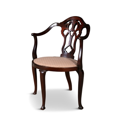 206 - AN EDWARDIAN MAHOGANY FRAMED CORNER CHAIR,  with single pierced vase shaped splat, raised on slender... 