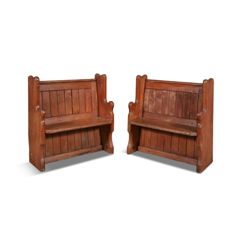 207 - A PAIR OF STAINED OAK PANEL BACK HALL SETTLES,  with angled back and solid panel seat, scrolled arm ... 