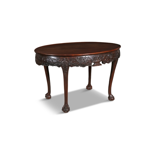 242 - A PAIR OF GEORGE III STYLE MAHOGANY OVAL CENTRE TABLES,  The tray tops with leaf and scroll carved f... 