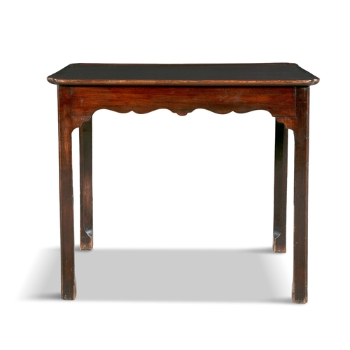 247 - AN IRISH GEORGE III MAHOGANY SIDE TABLE,   the shaped rectangular cavetto top on square chamfered le... 