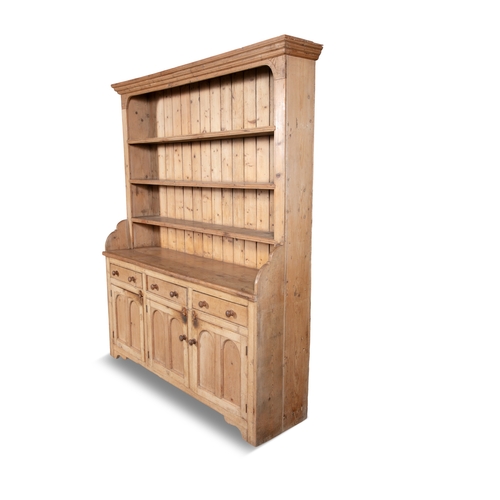 42 - A VICTORIAN PINE DRESSER,  the top section with moulded cornice above three shelves, the bottom sect... 