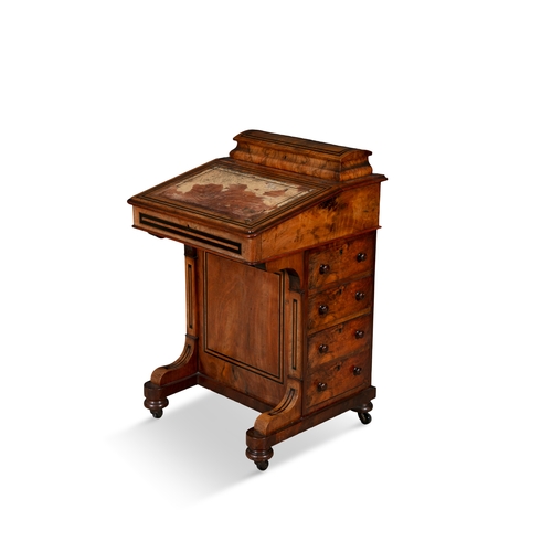 43 - A WALNUT INLAID DAVENPORT,   surmounted with stationary compartment, above hinged writing slope on f... 