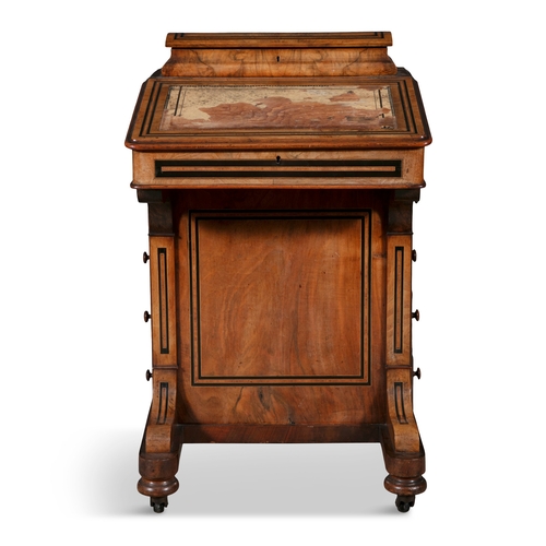 43 - A WALNUT INLAID DAVENPORT,   surmounted with stationary compartment, above hinged writing slope on f... 