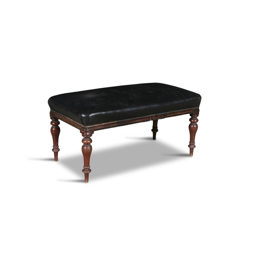 44 - A VICTORIAN MAHOGANY FRAMED CLOSE NAILED STOOL,  of rectangular form, the padded top covered in blac... 