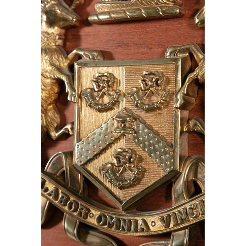 8 - A GILT-METAL ARMORIAL PANEL FOR BRADFORD CITY TRAMWAYS,   mounted on mahogany panel with Latin motto... 