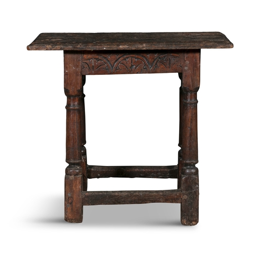 82 - AN OAK JOINT STOOL 17TH CENTURY,  the two board seat panel supported on turned splayed columns joine... 