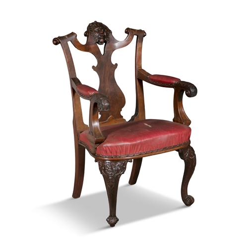 83 - AN IRISH GEORGE II STYLE MAHOGANY FRAMED ELBOW CHAIR 19TH CENTURY,   the shaped top rail centred wit... 