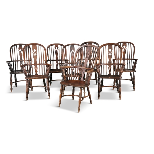 89 - A SET OF EIGHT ELM AND WILLOW WINDSOR ARMCHAIRS 19TH CENTURY,  each with arched openwork back with c... 