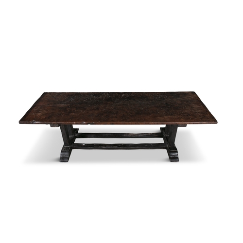 9 - A CONTINENTAL OAK REFECTORY TABLE 17TH CENTURY,   the rectangular two-plank top, raised on trestle-e... 