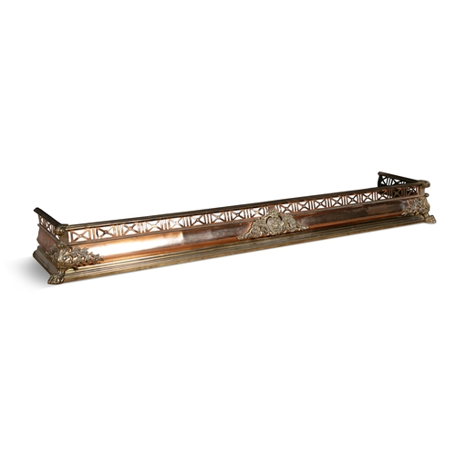 90 - A FRENCH BRASS AND COPPER FENDER LATE 19TH CENTURY,  with pierced trellis panel frieze and central c... 