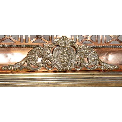 90 - A FRENCH BRASS AND COPPER FENDER LATE 19TH CENTURY,  with pierced trellis panel frieze and central c... 