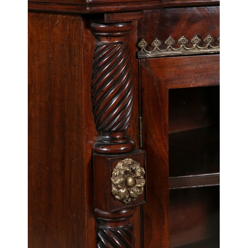 91A - A REGENCY BRASS MOUNTED MAHOGANY BOWFRONT SIDE CABINET,   the twin glazed cupboard doors  below the ... 