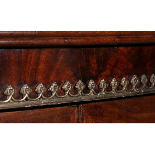 91A - A REGENCY BRASS MOUNTED MAHOGANY BOWFRONT SIDE CABINET,   the twin glazed cupboard doors  below the ... 