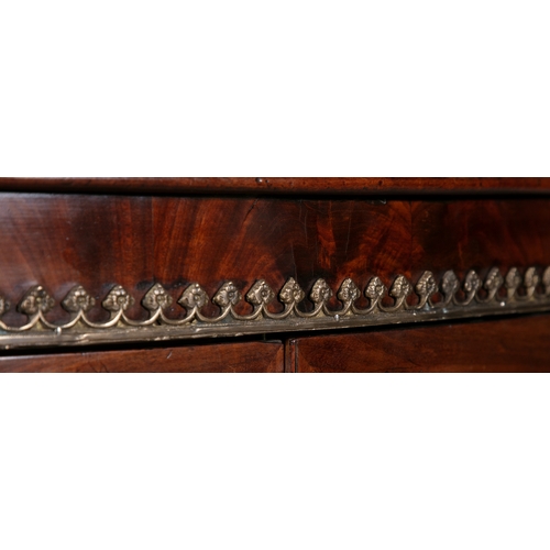 91A - A REGENCY BRASS MOUNTED MAHOGANY BOWFRONT SIDE CABINET,   the twin glazed cupboard doors  below the ... 