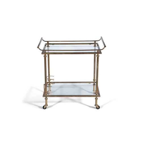 115 - DRINKS TROLLEY  A brass two tier drink’s trolley with glass tops on castors. Italy, c.1960. 68 x 41 ... 