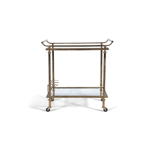 115 - DRINKS TROLLEY  A brass two tier drink’s trolley with glass tops on castors. Italy, c.1960. 68 x 41 ... 