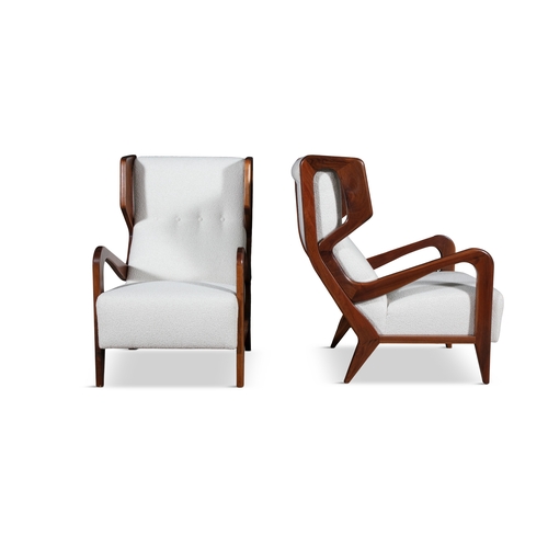 117 - LOUNGE CHAIRS  A pair of lounge chairs in the style of Gio Ponti. Upholstered in bouclé. Italy, c.19... 